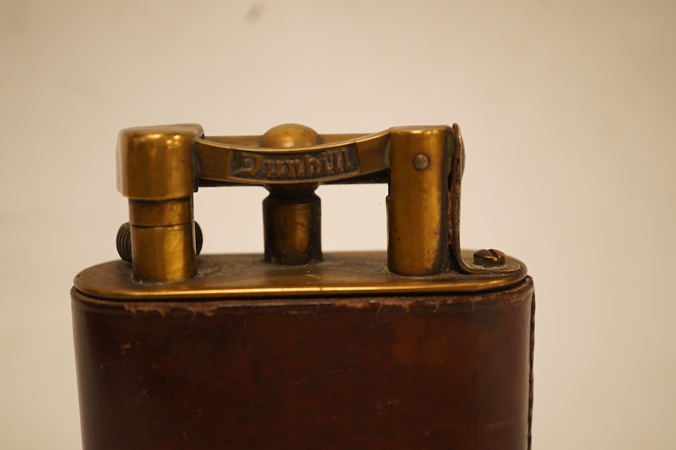 A Dunhill giant table lighter with brown leather outer cover, 11cm